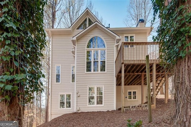 rear view of house with a deck