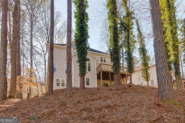 view of home's exterior with a wooden deck