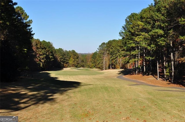 view of property's community with a lawn