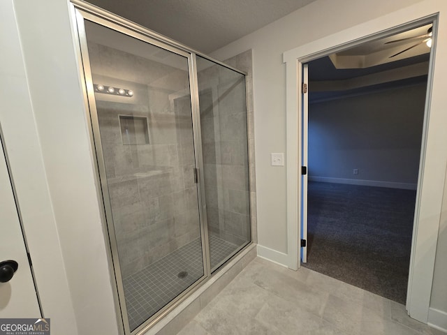 bathroom featuring an enclosed shower and tile patterned flooring