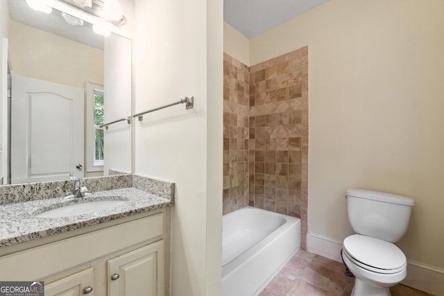 full bathroom with tiled shower / bath combo, vanity, and toilet