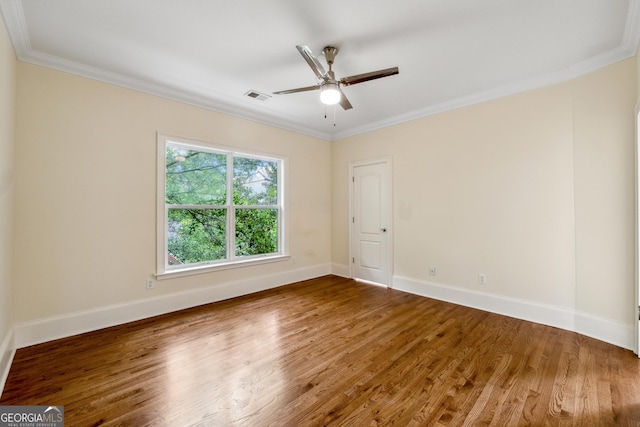 empty room with crown molding, ceiling fan, and hardwood / wood-style floors