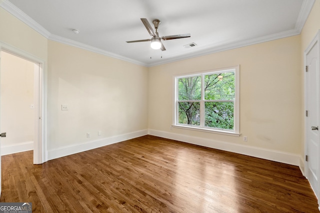 empty room with crown molding, ceiling fan, and dark hardwood / wood-style flooring