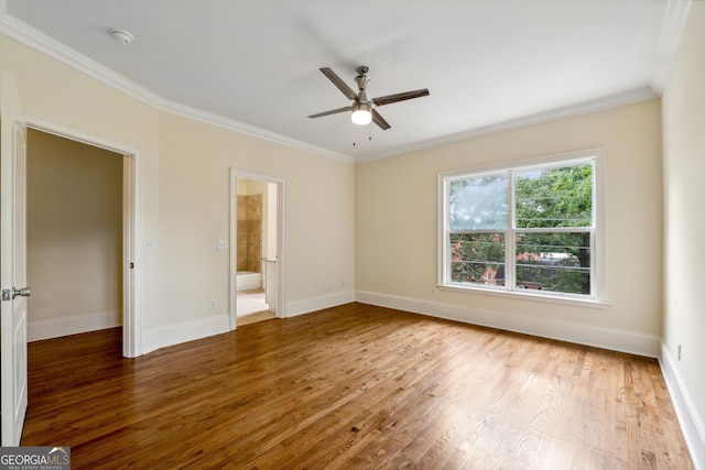 unfurnished bedroom featuring crown molding, ceiling fan, connected bathroom, and hardwood / wood-style floors