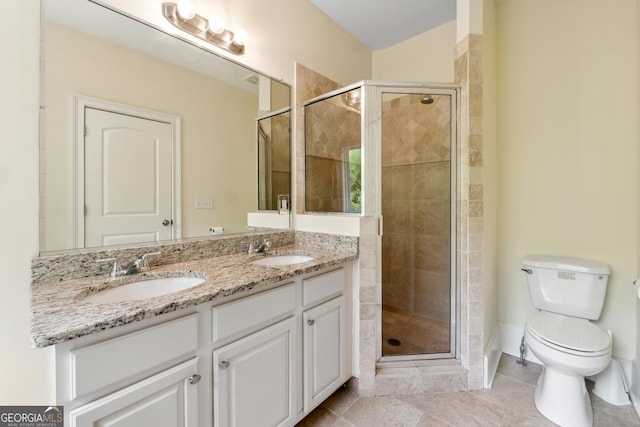 bathroom featuring vanity, toilet, and an enclosed shower