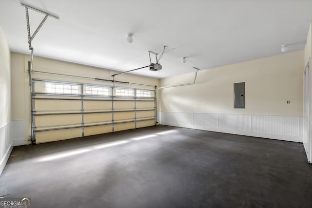 garage featuring a garage door opener and electric panel