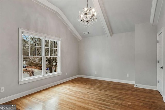 interior space featuring hardwood / wood-style flooring, a chandelier, and vaulted ceiling with beams