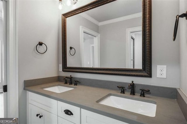 bathroom featuring crown molding and vanity