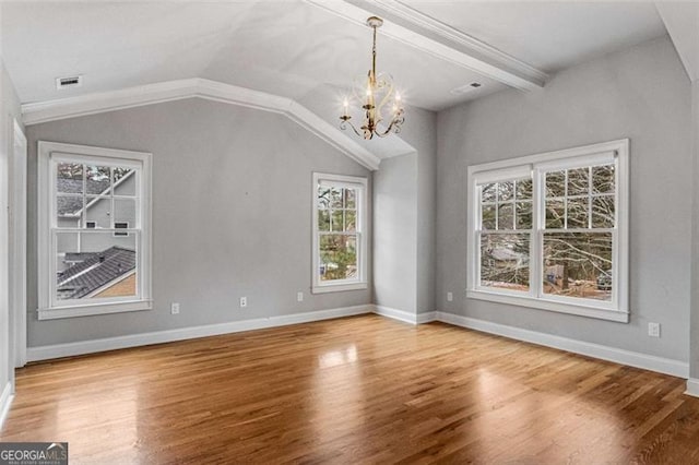 interior space featuring lofted ceiling with beams, hardwood / wood-style floors, and a wealth of natural light