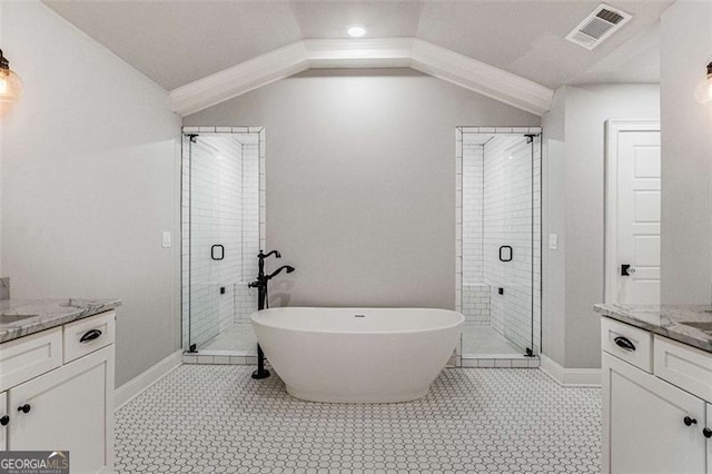 bathroom featuring lofted ceiling, vanity, and independent shower and bath