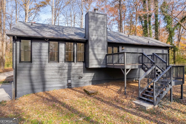 view of side of property featuring a wooden deck