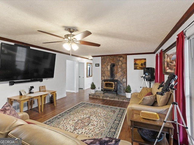 living room with ornamental molding, dark hardwood / wood-style floors, and a textured ceiling