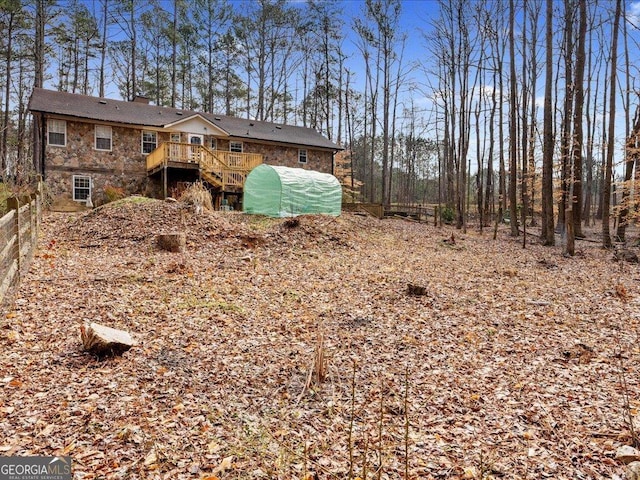 view of yard with a wooden deck