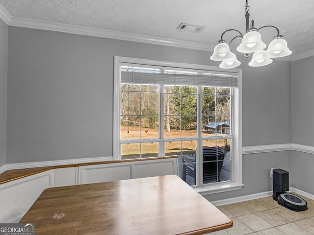 unfurnished dining area with light tile patterned flooring, plenty of natural light, crown molding, and a textured ceiling