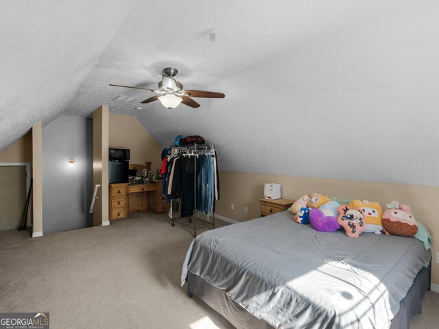 carpeted bedroom featuring lofted ceiling and ceiling fan