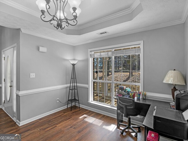 home office with crown molding, dark hardwood / wood-style floors, a raised ceiling, and a chandelier