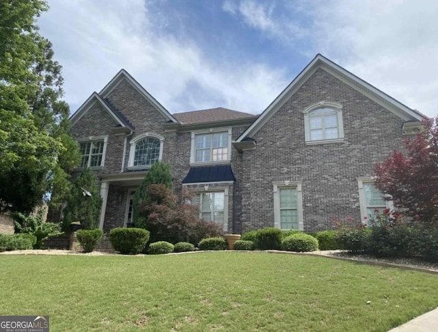 front facade with a front lawn