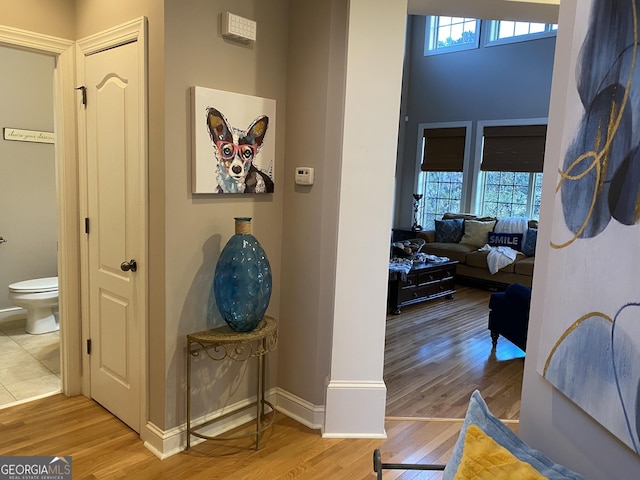 hall with light hardwood / wood-style flooring