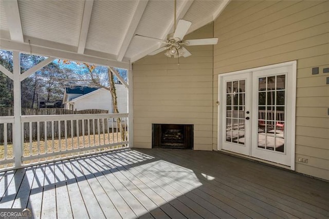 deck featuring ceiling fan and french doors