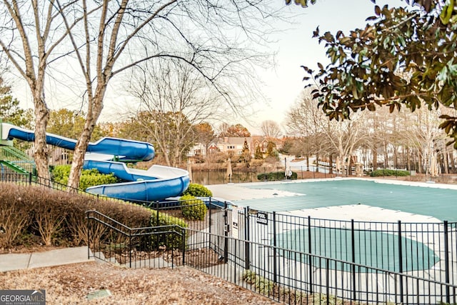 view of swimming pool featuring a water slide