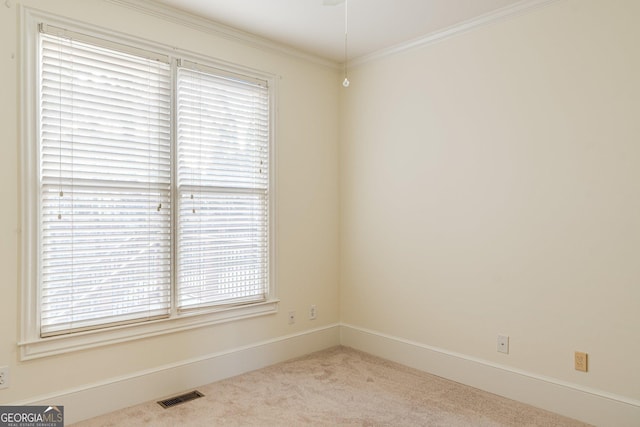 carpeted empty room with ornamental molding