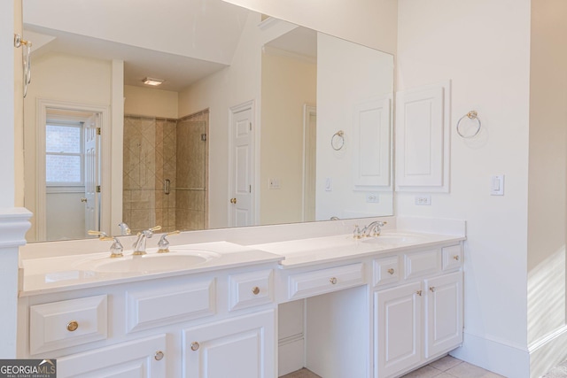 bathroom featuring vanity, tile patterned floors, and a tile shower