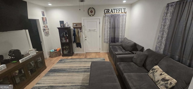 living room with recessed lighting and light wood finished floors