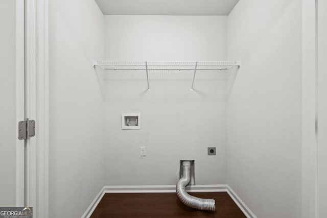 clothes washing area featuring electric dryer hookup, washer hookup, and wood-type flooring