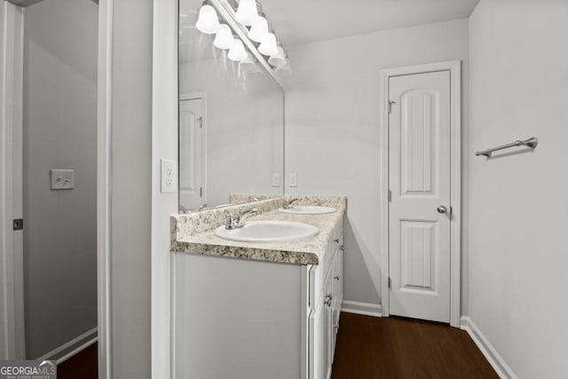 bathroom with vanity and hardwood / wood-style flooring