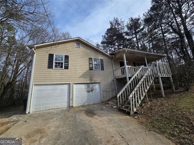 view of front of property with a garage and covered porch