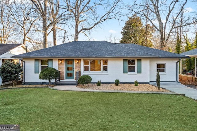 ranch-style home with a front lawn