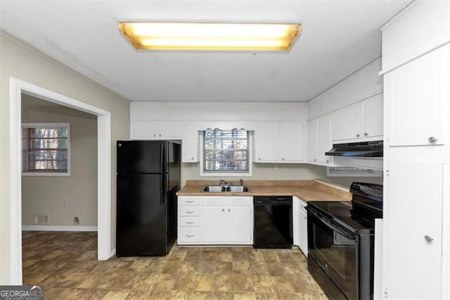 kitchen with white cabinetry, sink, and black appliances