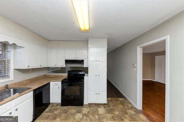 kitchen with white cabinetry, sink, a textured ceiling, and black appliances