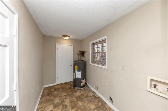 laundry area with hookup for a washing machine and electric water heater