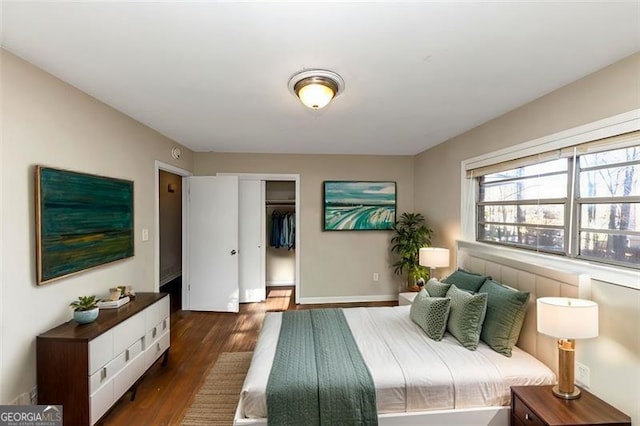 bedroom featuring dark hardwood / wood-style flooring and a closet