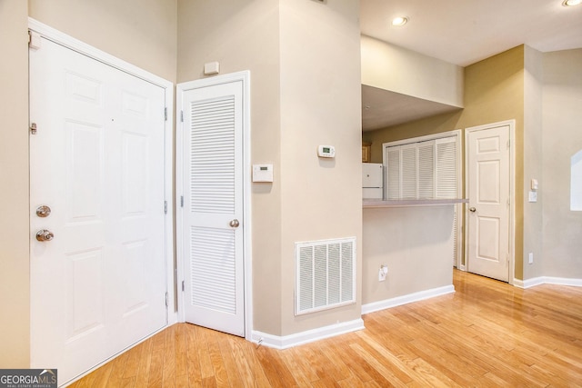 entrance foyer with light hardwood / wood-style flooring