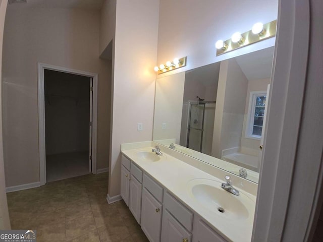 bathroom with vanity and separate shower and tub