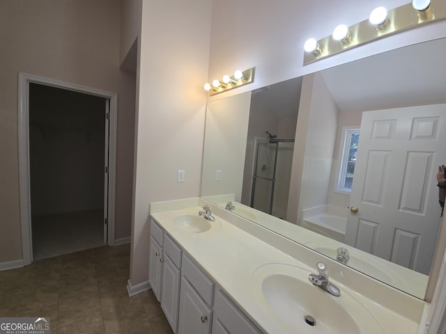 bathroom featuring vanity, independent shower and bath, and tile patterned flooring