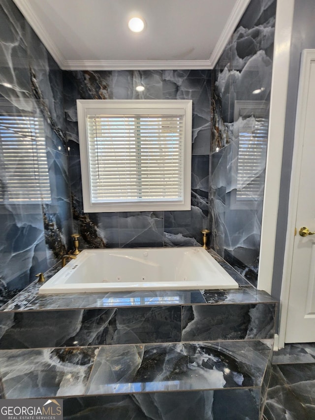 bathroom featuring a relaxing tiled tub, ornamental molding, and tile walls