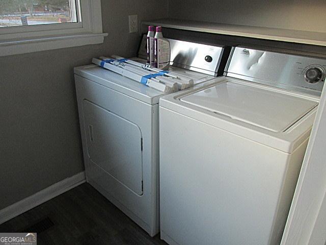 clothes washing area featuring washing machine and dryer