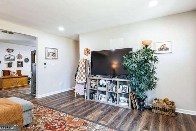 living room with dark hardwood / wood-style floors