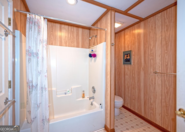 bathroom featuring shower / bathtub combination with curtain, wooden walls, and toilet