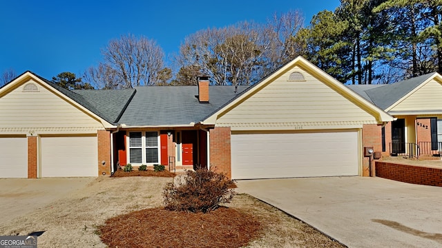 single story home featuring a garage