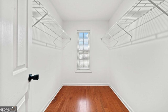 walk in closet featuring hardwood / wood-style floors