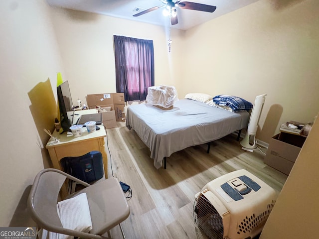 bedroom with ceiling fan and light hardwood / wood-style floors