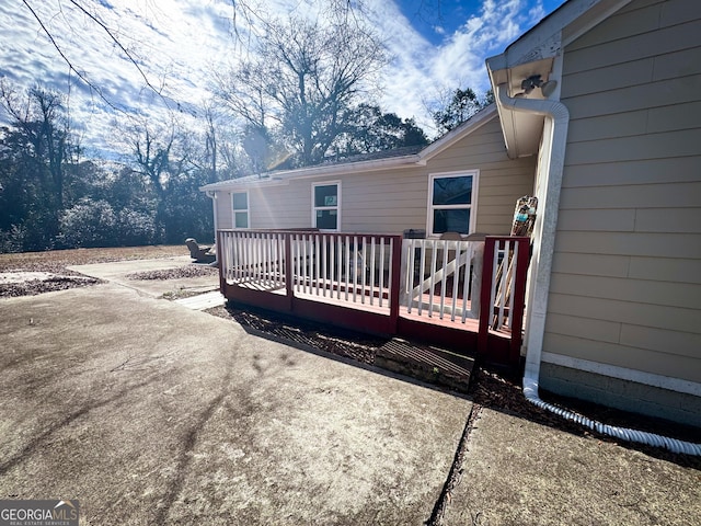 back of property with a deck