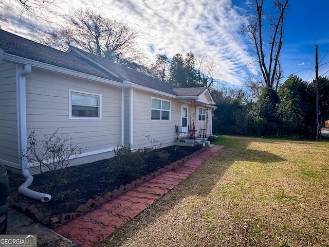 exterior space with a yard