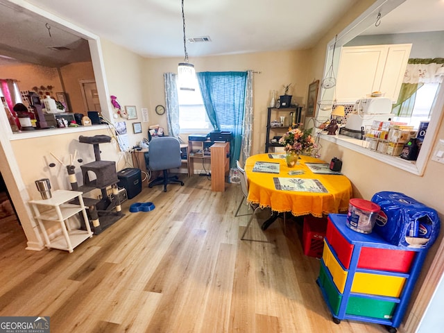 dining room with light hardwood / wood-style flooring