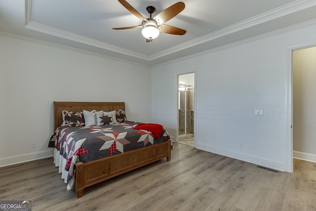 bedroom with light wood-type flooring, visible vents, and crown molding