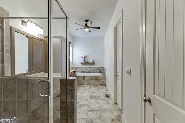 bathroom featuring a stall shower, a garden tub, and a ceiling fan